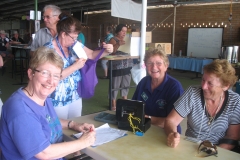 Volunteers and visitors in the undercover area.